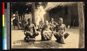 Women grinding grain outdoors, Congo, ca.1920-1940