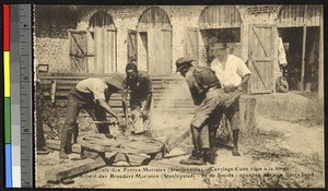 Putting a rim on a cartwheel, Kisangani, Congo, ca.1920-1940