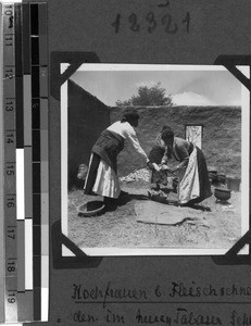 Cooking women cutting meat, South Africa East