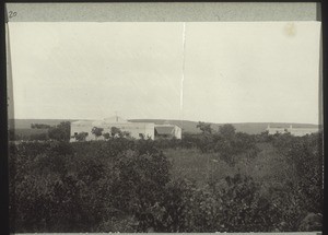 "Summaddi compound. For the Inspector. On the right the mission house facing West. Next to it to the left 1 catechist's house and teachers' quarters, further right on the edge the girls' boarding school