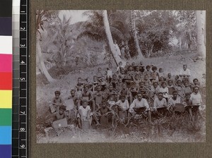 Group portrait of school class outdoors, Delena, Papua New Guinea, ca. 1905-1915
