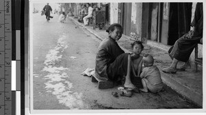 Woman bathing her children, Loting, China, ca. 1935