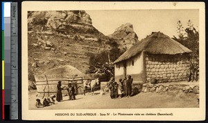 Missionary father visits a woman and her children, Lesotho, ca.1900-1930