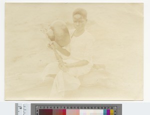 Boy with a musical instrument, Blantyre, Malawi, ca.1910