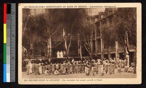 Missionary sisters looking on as young children play outdoors, Madagascar, ca.1920-1940