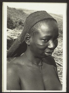 Baptismal candidate in Bakobngwang. She has made the band around her head herself, and uses it to carry her loads back from the field