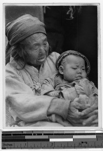 Korean grandmother holding her grandchild, Cheju Island, Korea, ca. 1949