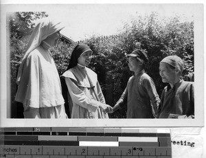 Sisters greet parishioners at Lipu, China