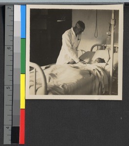 Dr. Tucker checking on a patient, Shanghai, China, ca.1925