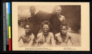 Chief holding parasol with other men flanking him, Congo, ca.1920-1940