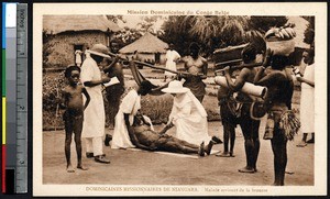 Missionary sister treats a recently arrived patient, Niangara, Congo, ca.1900-1930