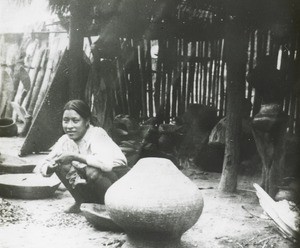 Woman and clay pots, Peru, ca. 1947