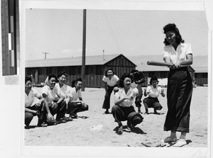 Women playing baseball at the Japanese Relocation Camp, Manzanar, California, July 1942