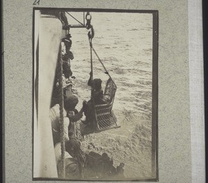 A black woman disembarking in a basket