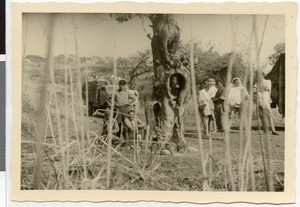 Group of travelers next to a smouldering waddessa tree, Ethiopia, 1952