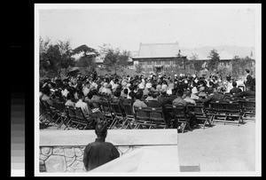 Woman faculty member preaching at Easter worship service, at Yenching University, Beijing, China, 1930