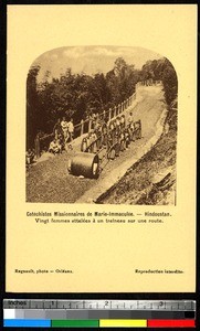 Women pulling a sled down a dirt road, India, ca.1920-1940