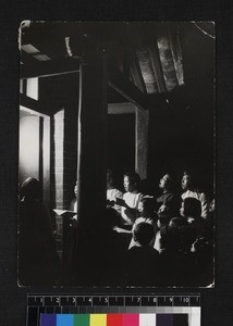 Group of carol singers at doorway, Yunnan, China, 1934