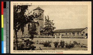 Students lining up before a large stone school building, Tanganyika, ca.1920-1940