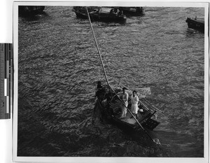 Boat merchants in Hong Kong harbor, China, 1947