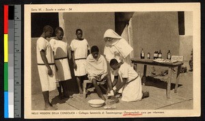 Trainees tending a woman's leg while watched by a missionary sister, Tanganyika, ca.1920-1940