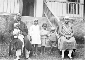 African family in front of a veranda, Tanzania, ca.1893-1920