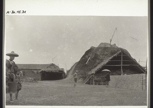 Tile works in Hoi Ping near Canton (China). With a water-carrier