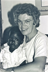 DMS Misssionary Ida Kongsbak at Lukajange, Tanzania. Here seen with a small child, 1989