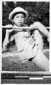 Japanese boy climbing on a pole, Japan, ca. 1938