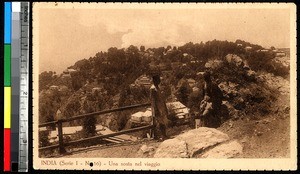 Two men stopping along a road, India, ca.1920-1940