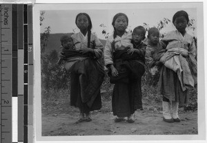 Three girls carrying babies, Korea, ca. 1920-1940