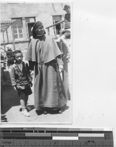 Maryknoll Sister and child at Dalian, China