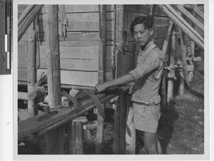 Apprentice to a blacksmith at Henan, China, 1949