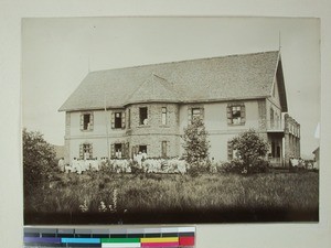 Andranomadio Mission Hospital with many patients gathered in front, Antsirabe, Madagascar, ca.1904