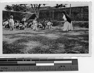 Maryknoll Sisters plays with orphans at Luoding, China, 1937