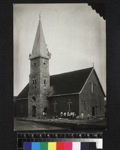 Congregation outside church and climbing steeple, Ambatonondrazaka, Madagascar, ca. 1900