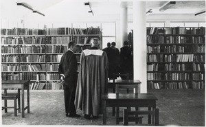 Professors and students inside of the library of the University of the Botswana, Lesotho and Swaziland