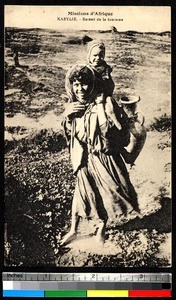 Mother with child transporting water, Algeria, ca.1920-1940