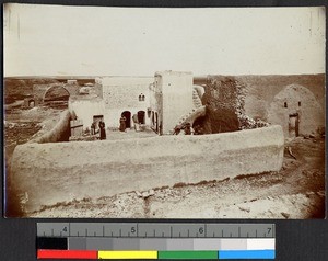 People standing inside the mud-walled courtyard of a chapel and school, Syria, ca.1856-1910