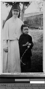 Maryknoll Sister and young orphan, Loting, China, 1933