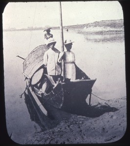 Two missionaries on a small boat, Changde, Hunan, China, ca.1900-1919