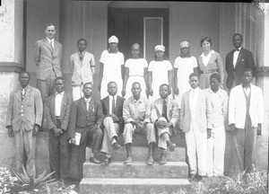 African school teachers standing in front of the entrance to a building, southern Africa