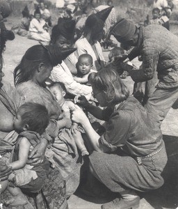 Missionary's wife vaccinating child, Yunnan, China, ca. 1942