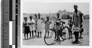 Group portrait with a bicycle, Africa, 1947