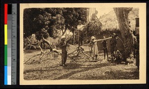 Missionaries and other people working outside a mission building, Cote d'Ivoire, ca.1920-1940