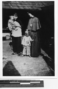 Sister Magdalena Urlacher with Chinese family in Meixien, China, 1940