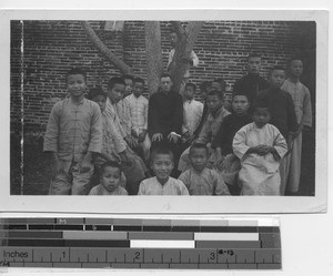 Fr. Smith with boys at Yangjiang, China, 1938