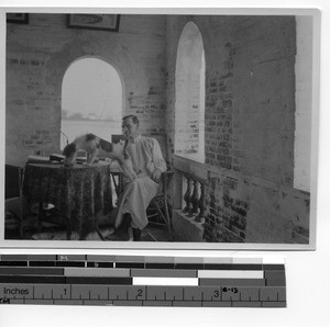 Fr. Thomas A. O'Melia and dog at Haiyan, China, 1924