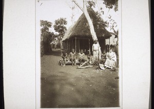 Hut in Bali. In front: Mrs Vielhauer with natives