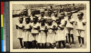 A number of young girls gathered outdoors for a celebration, Congo, ca.1920-1940